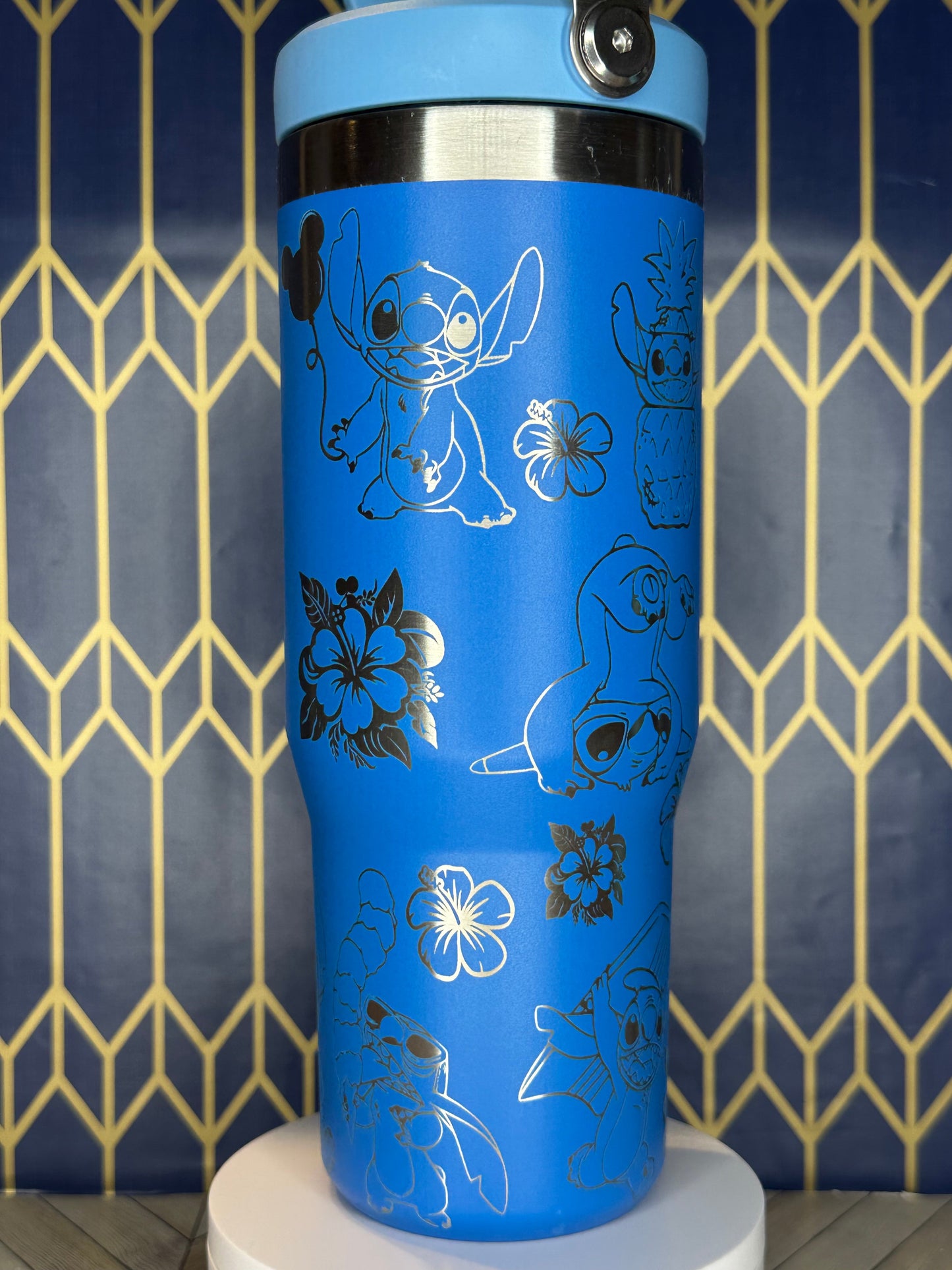 a close up of a blue cup on a wall