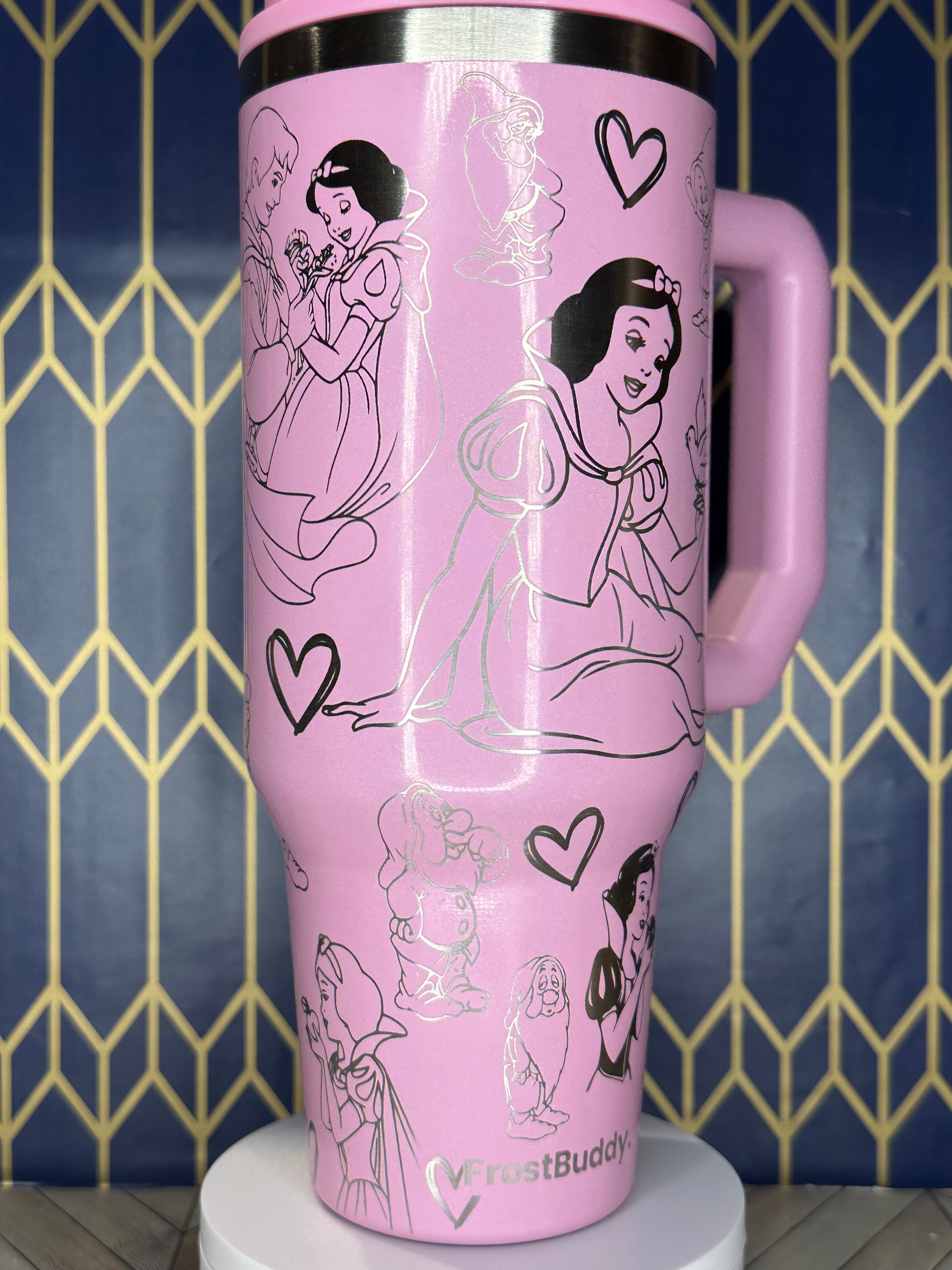 a pink cup with a picture of a woman on it