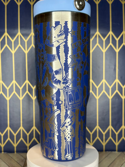 a close up of a blue and silver cup on a wall