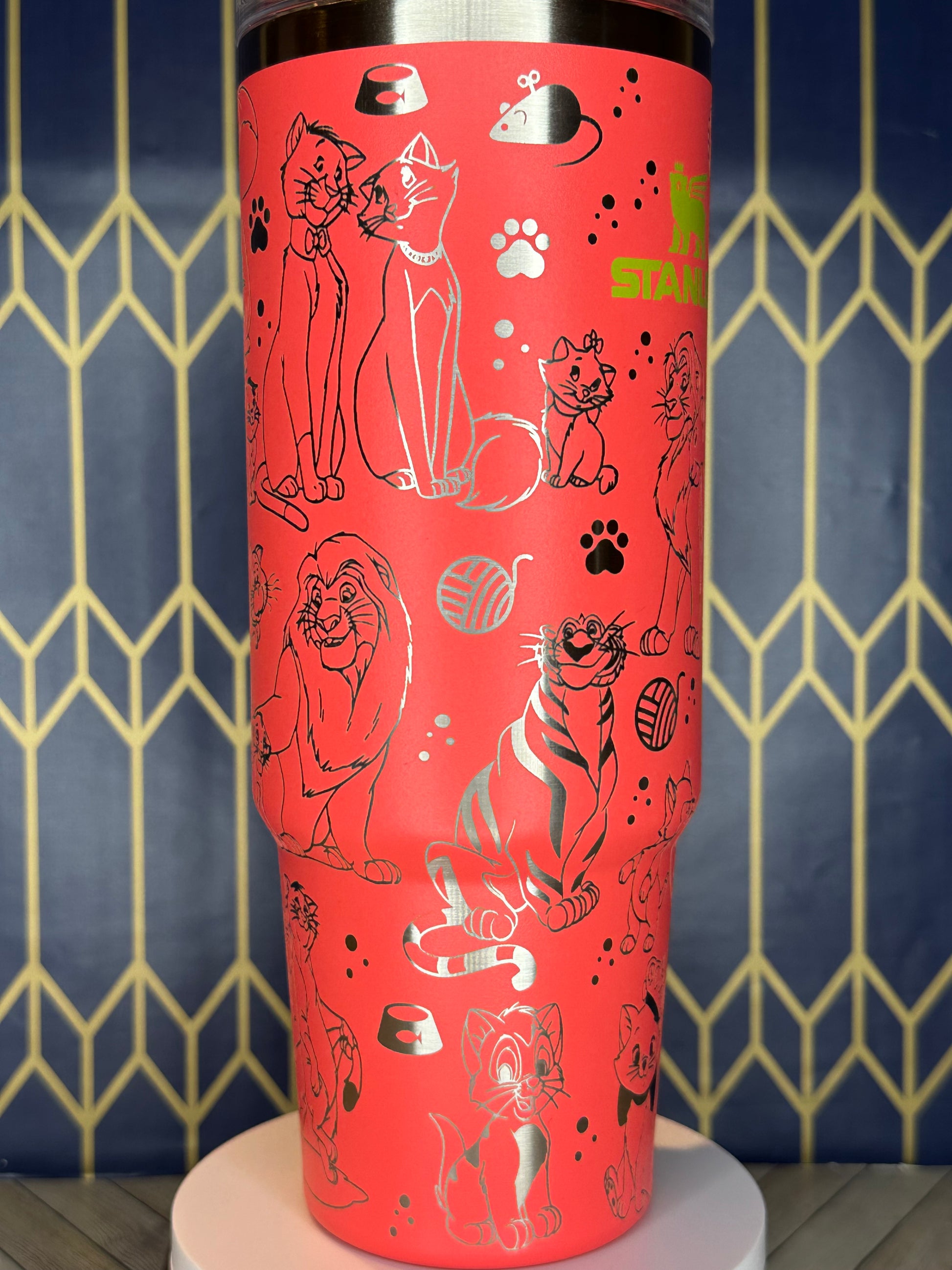 a close up of a red tube with drawings on it