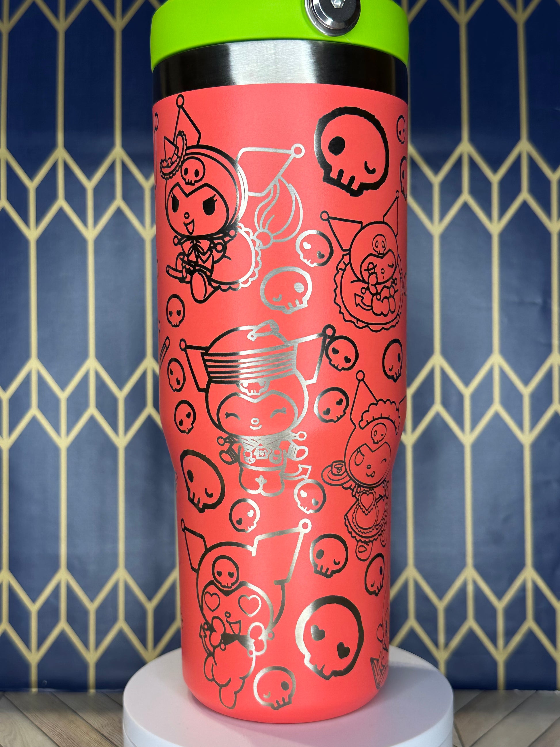 a red cup with a black and white design on it