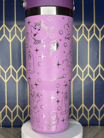 a pink cup with black and white designs on it