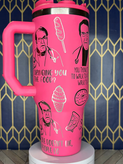 a pink coffee cup with a picture of a woman's face on it