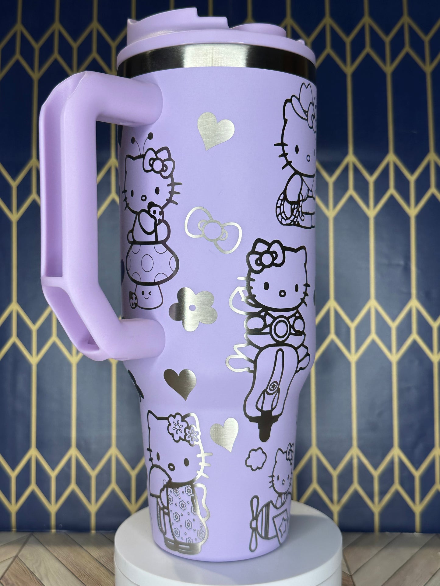 a purple hello kitty water bottle holder on a wall