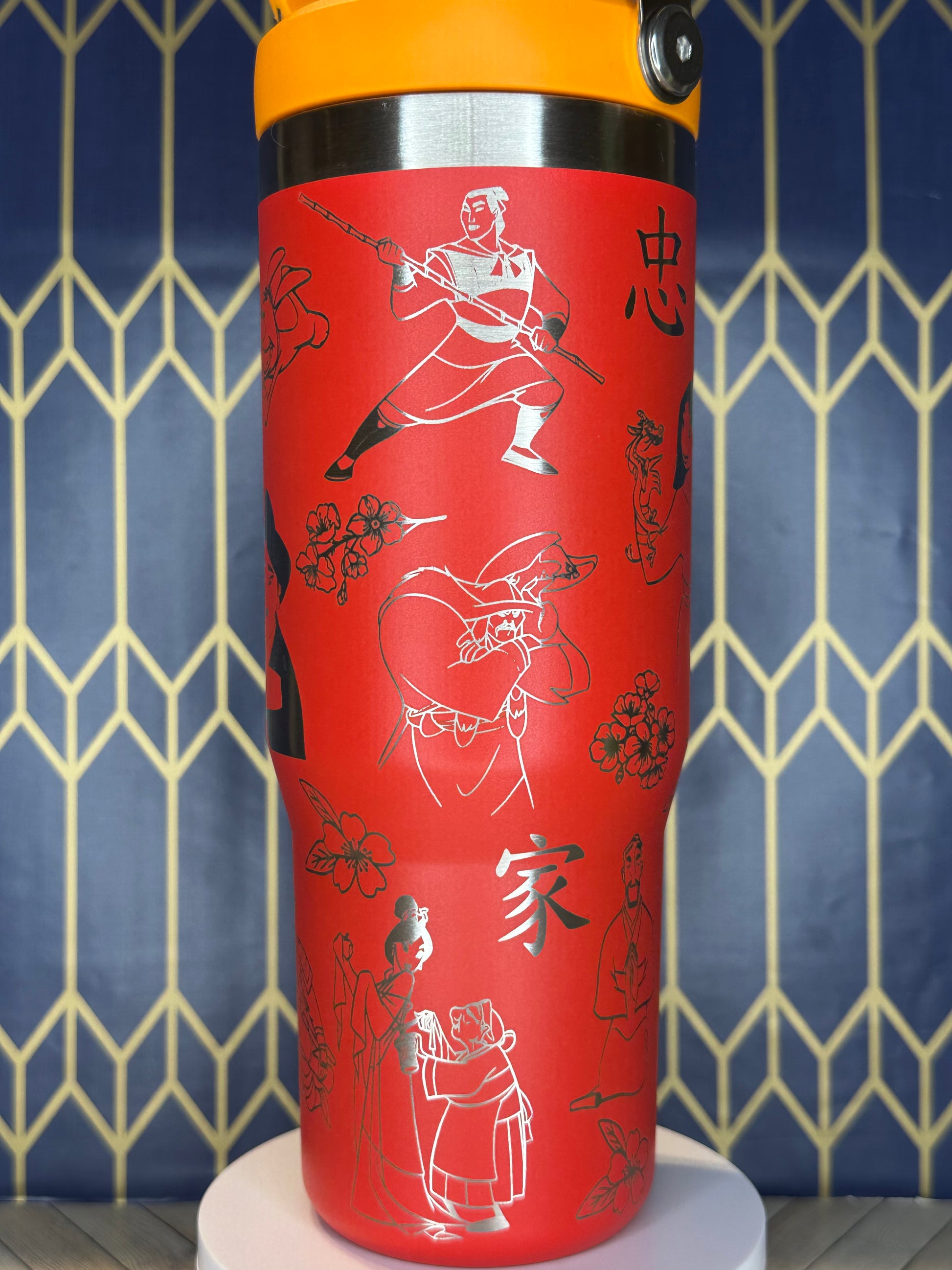 a close up of a red cup with drawings on it