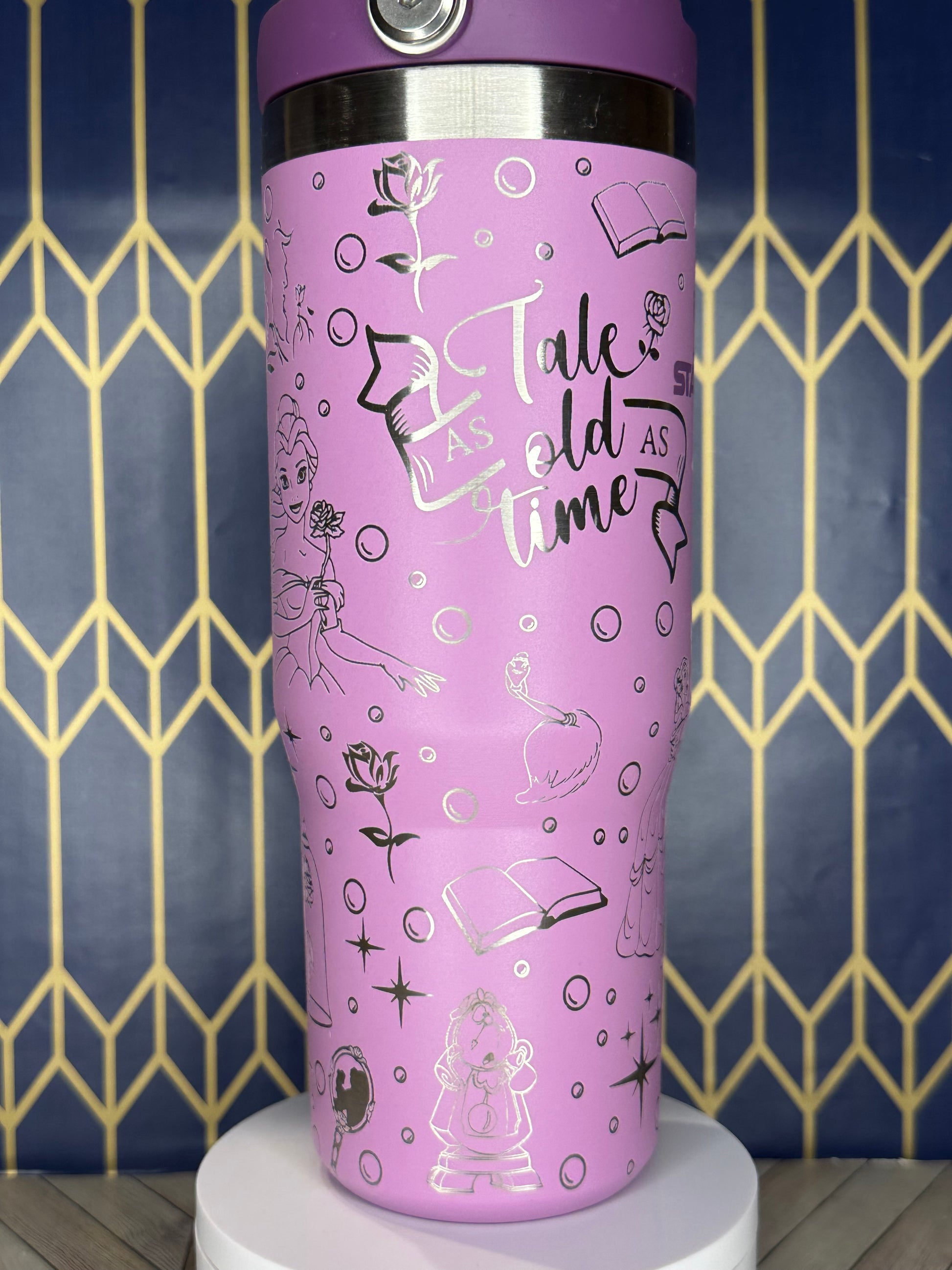 a close up of a pink cup with writing on it