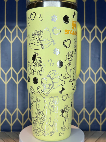 a close up of a yellow cup with drawings on it