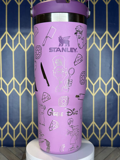 a purple cup with writing on it sitting next to a wall