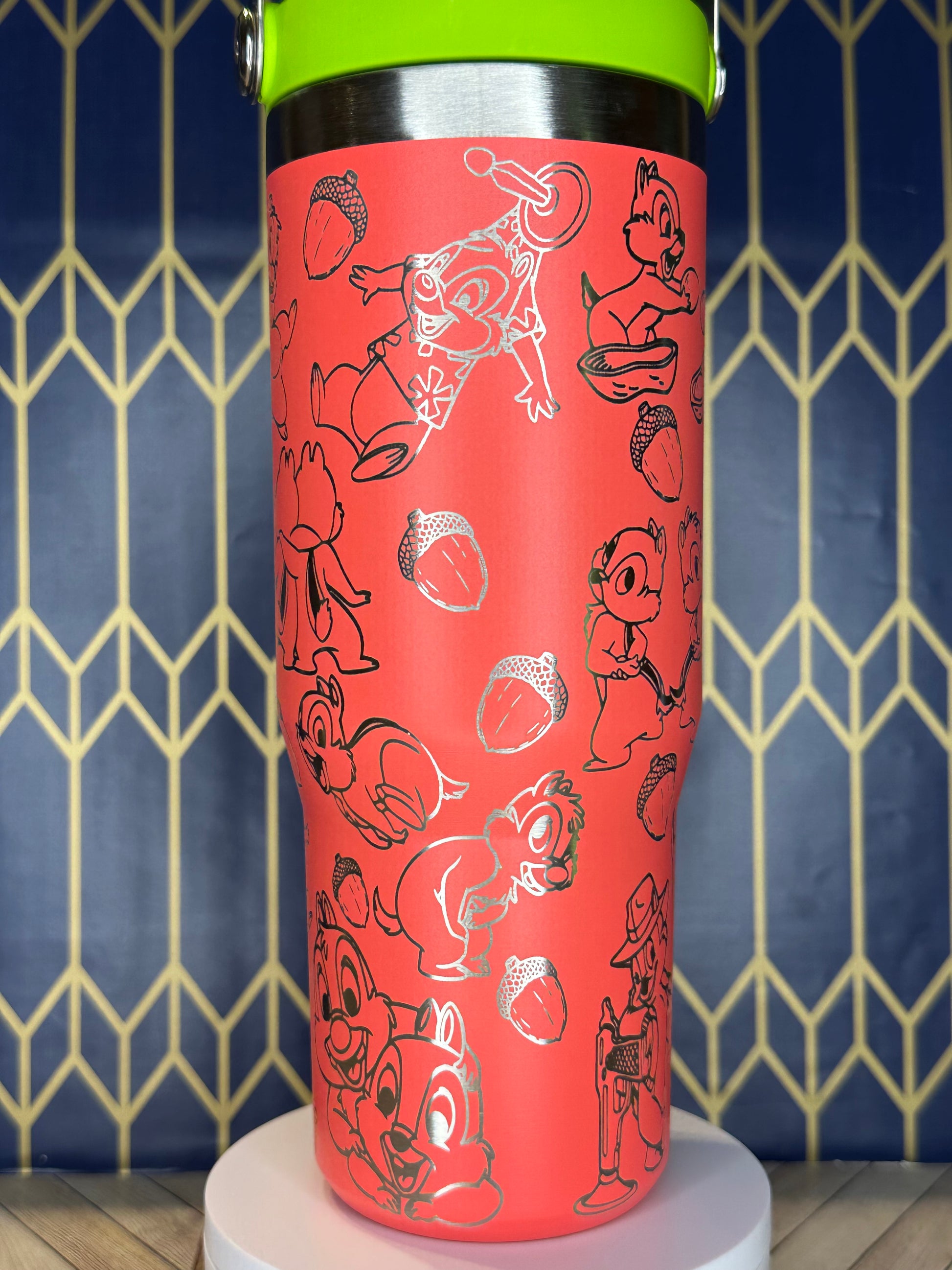 a close up of a red cup on a wall