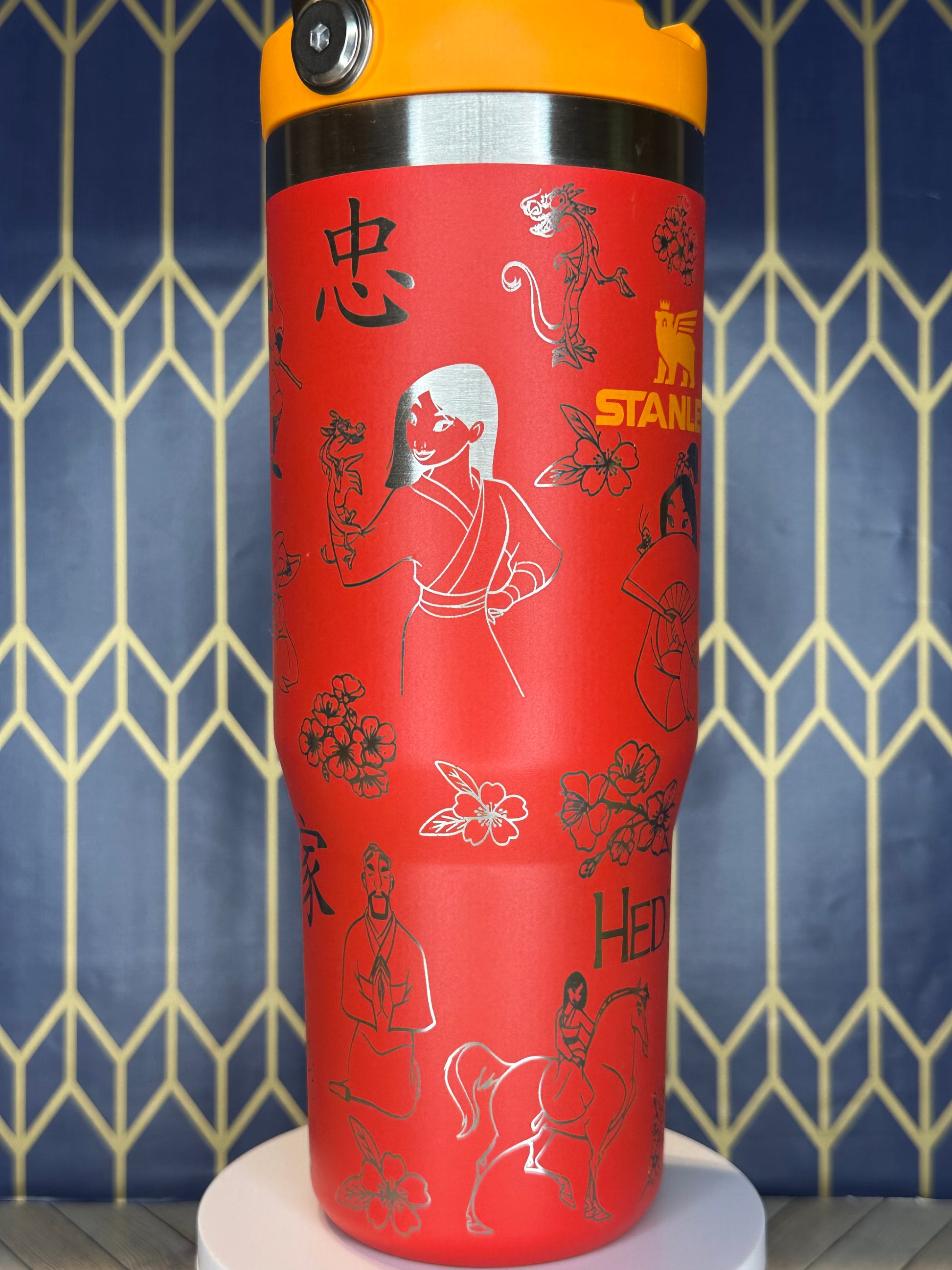 a close up of a red cup on a wall