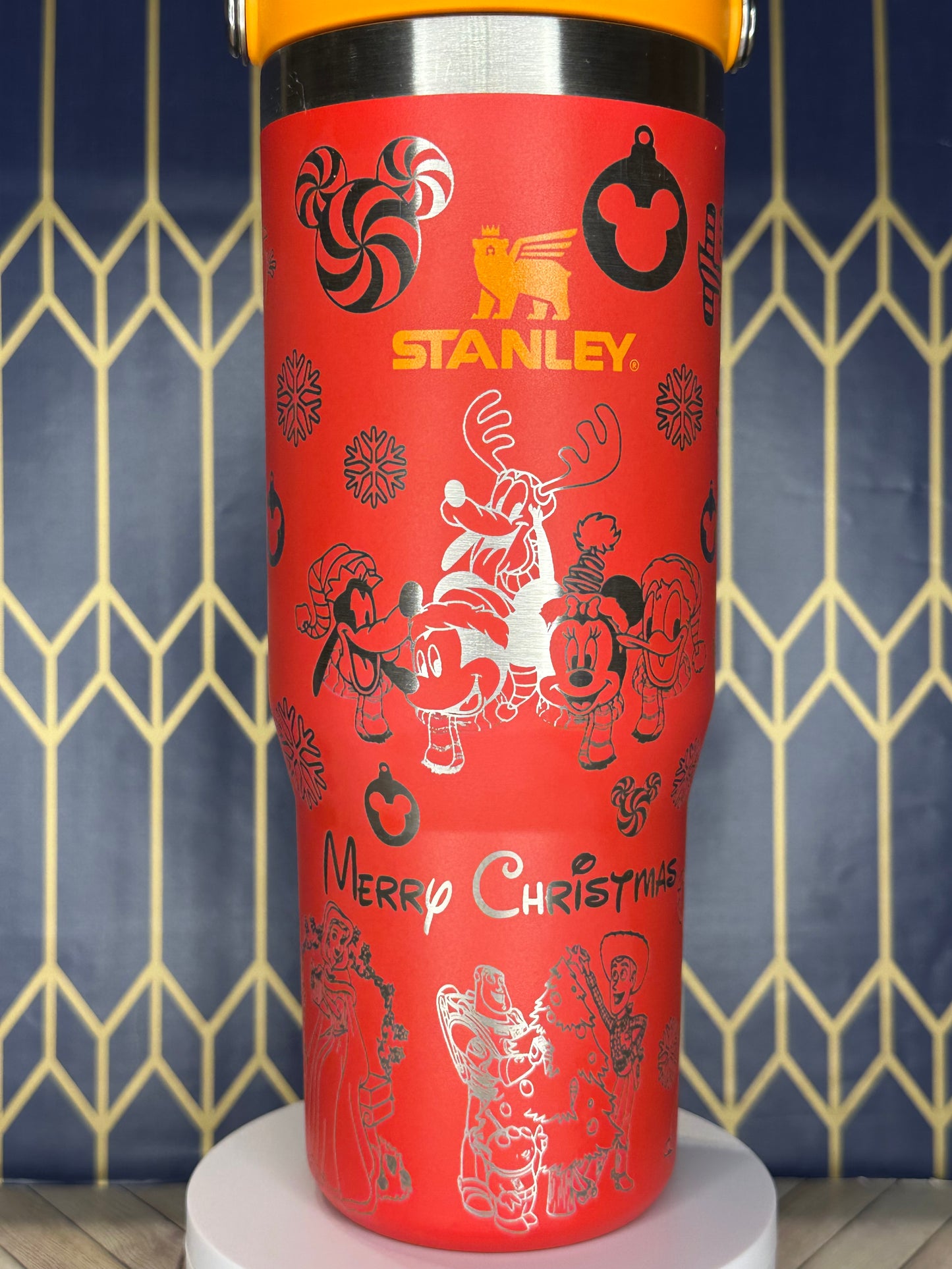 a close up of a red cup on a wall