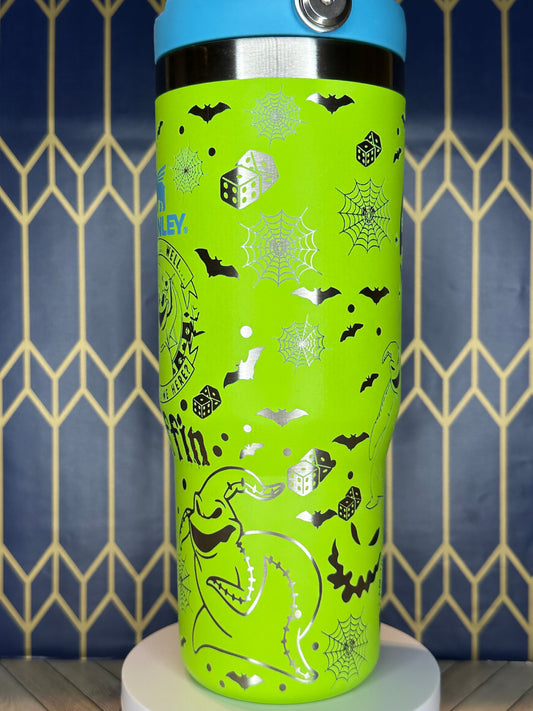 a close up of a green and blue water bottle