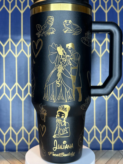 a black and gold coffee cup with a handle