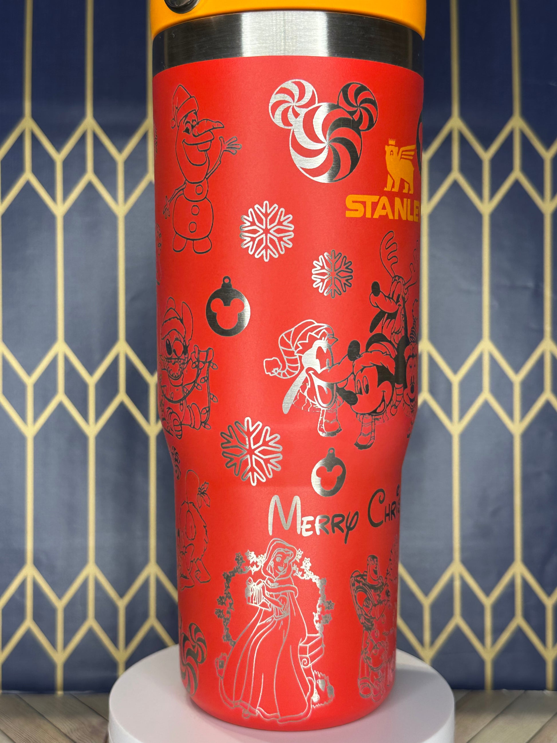 a close up of a red tube with designs on it