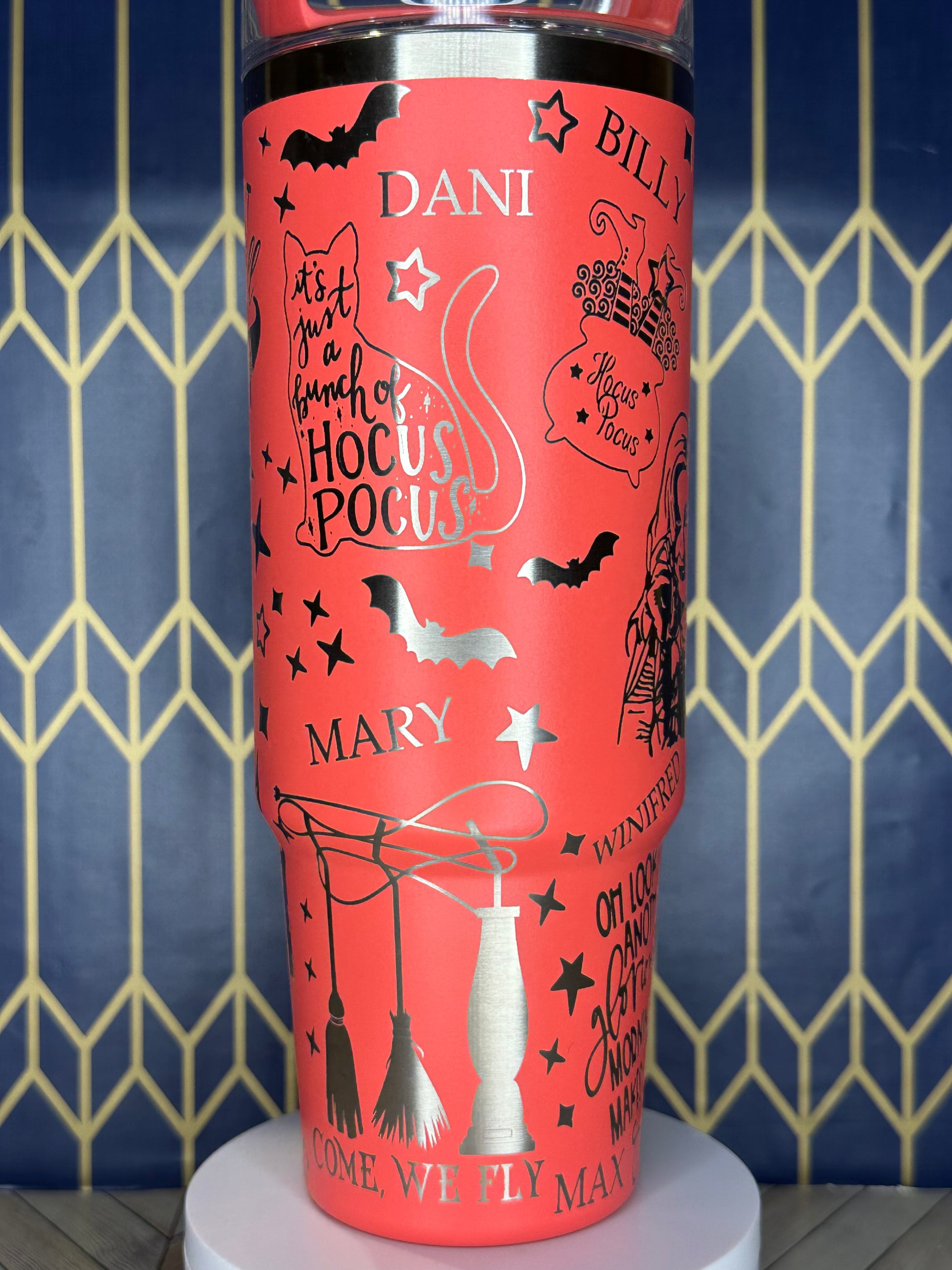 a red tube with writing on it sitting on a wall