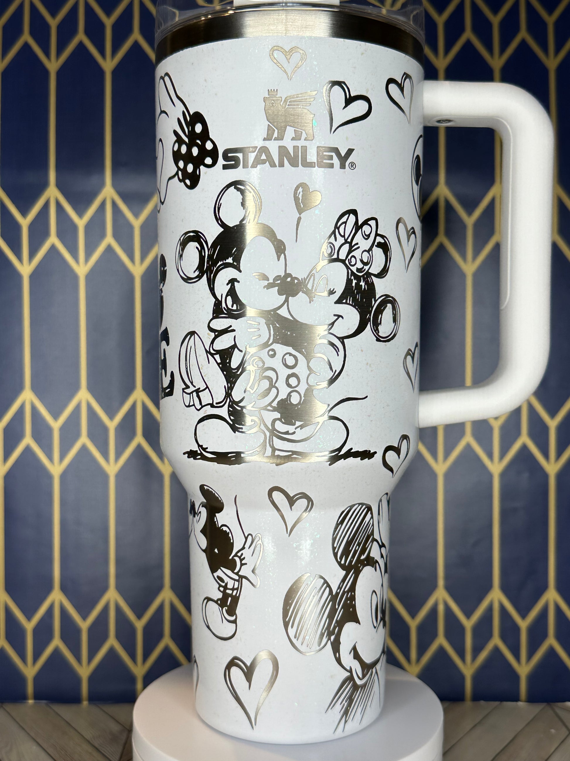 a white coffee cup with black and white designs on it