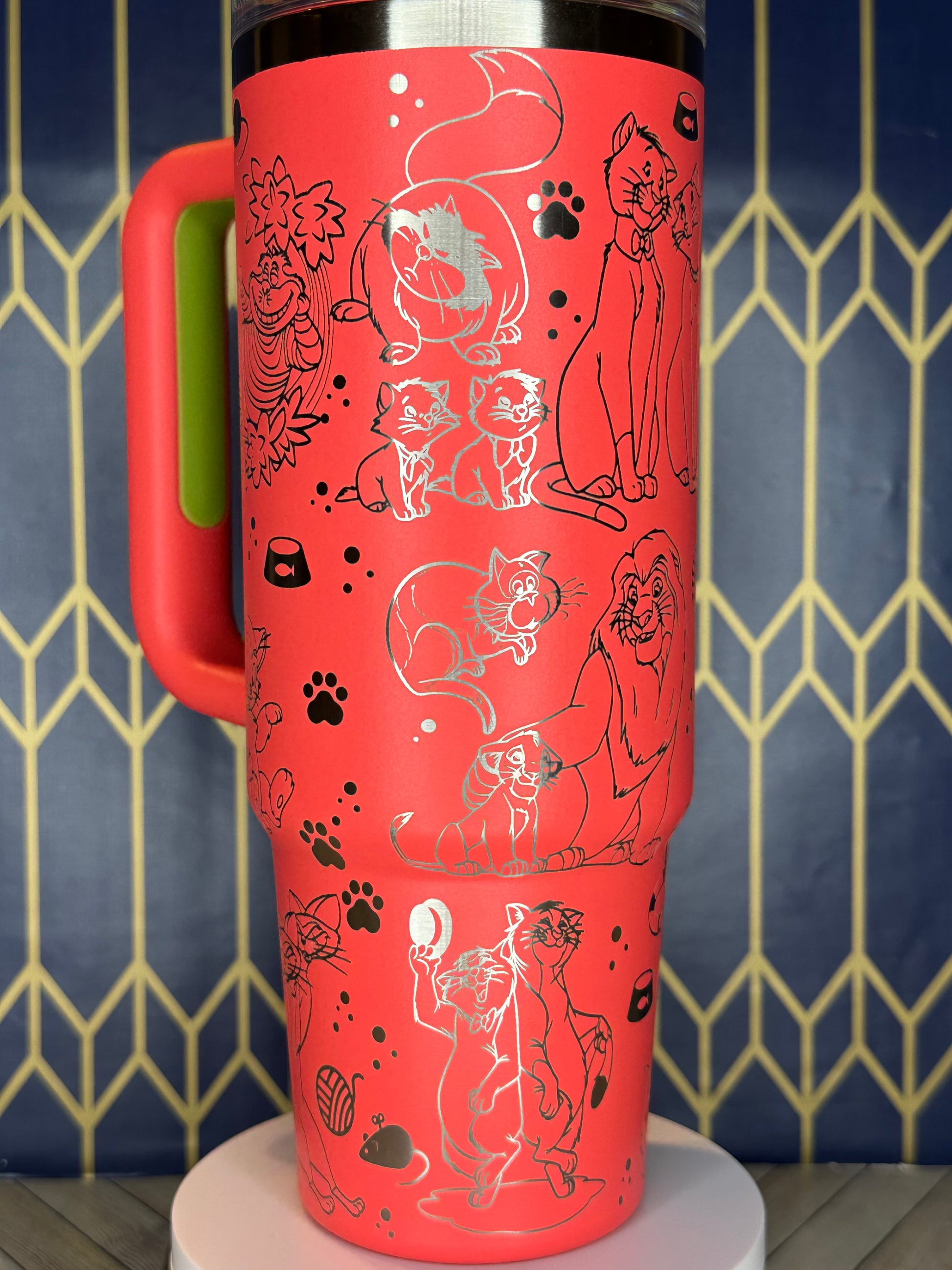 a close up of a red cup on a stand