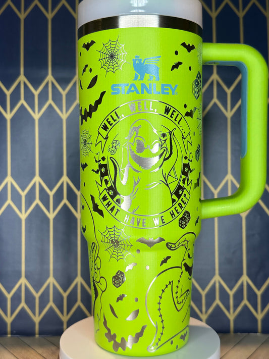 a green and white cup with a handle on a wall