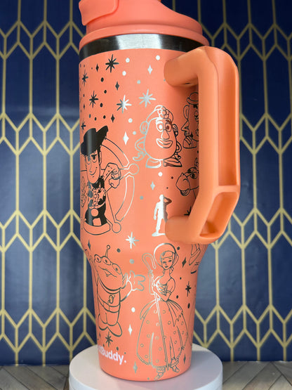 a pink cup with a cartoon design on it