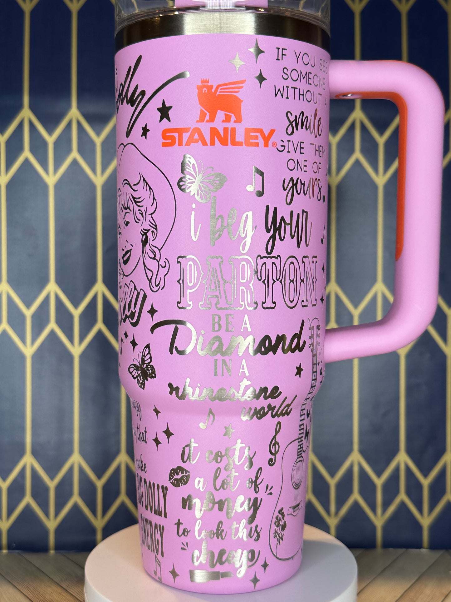 a pink coffee cup with writing on it