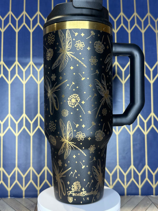 a black and gold coffee mug hanging from a hook