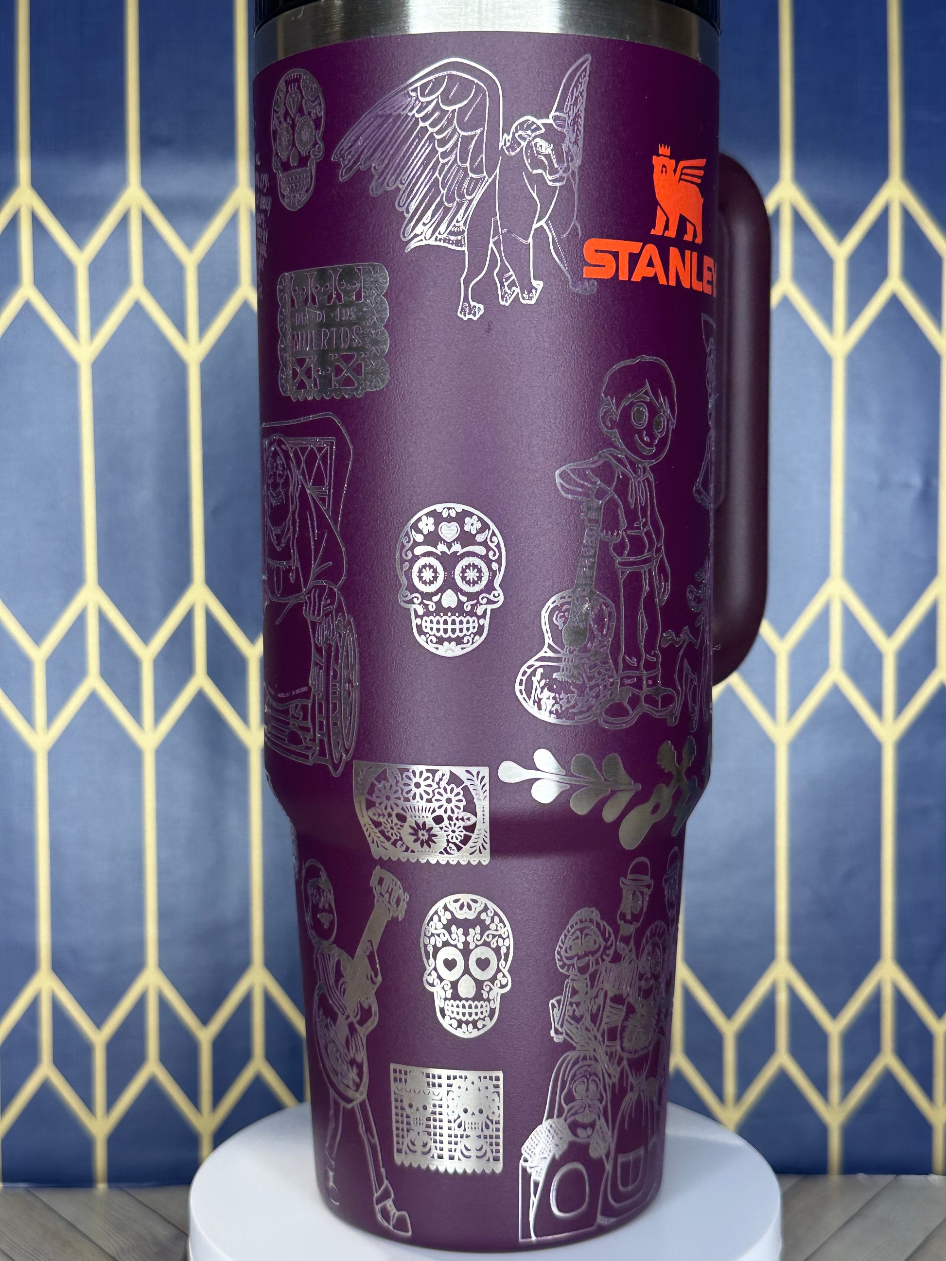 a purple coffee cup with a pattern on it