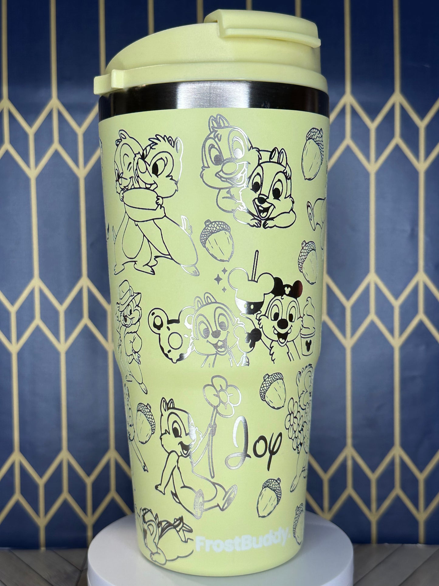 a close up of a cup with drawings on it