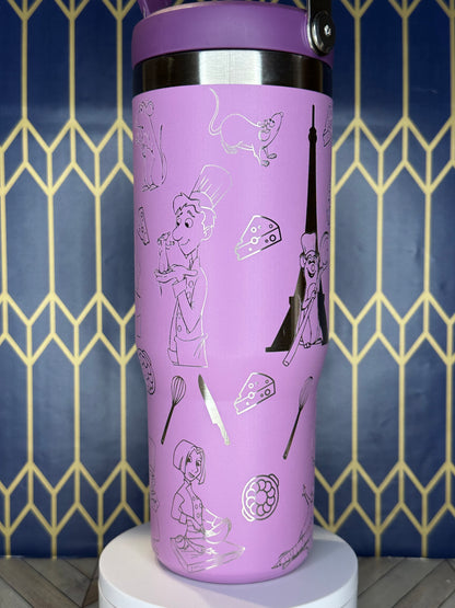 a purple cup with drawings on it sitting on a wall